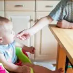 What should babies between one and twelve months eat?